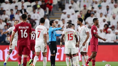 UAE players argue with the referee during their Asian Cup semi-final.