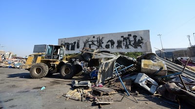A bulldozer removes the tents of protesters from Tahrir Square in central Baghdad, Iraq. EPA