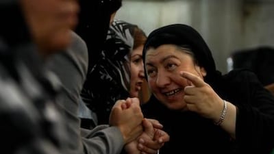 Defeated female candidates of Afghanistan's September 2010 election greet each other during a break in proceedings at the special electoral tribunal in a Kabul courtroom, Afghanistan yesterday.