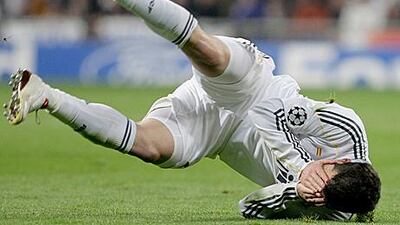 Real Madrid's Gonzalo Higuain tumbles over during a draw with Lyon last March.