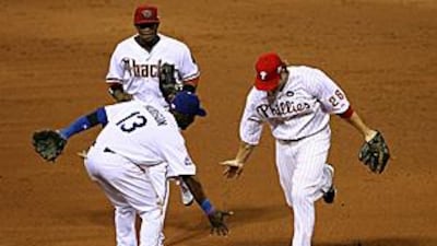 National League All-Star Jayson Werth of the Philadelphia Phillies celebrates a catch with teammates Orlando Hudson of the Los Angeles Dodgers and Justin Upton of the Arizona Diamondbacks during the 2009 MLB All-Star Game.