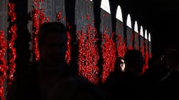 Members off the public walk past the Wall of Remembrance before the start of the Last Post ceremony at the Australian War Memorial in Canberra on April 15, 2026. (Photo by DAVID GRAY / AFP)