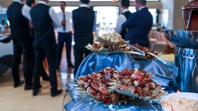 The service staff arrive for the afternoon briefing where they receive feedback from last night's iftar and will learn about the evening specials. Victor Besa / The National
