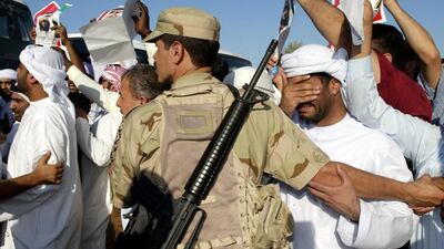 All pretence of normal life ceased; offices were deserted and shops shuttered. Many of those waiting and watching held up photographs of the man known to all as “father”. Rabih Moghrabi / AFP