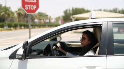 Learner-driver Maria Al Faraj stops the car at a junction. Ahmed Jadallah / Reuters