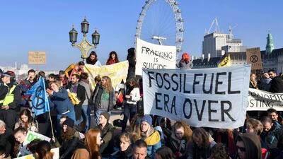 Demonstrators on Westminster Bridge in London for a protest group called 'Extinction Rebellion' to raise awareness of the dangers posed by climate change. PA via AP