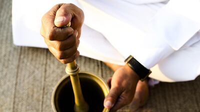 A big draw for customers is dinner in a traditional Bedouin camp site. Seen here is Moosr preparing traditional coffee. Lee Hoagland / The National