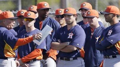 Houston Astros third base coach Dave Trembley talks to the players during a spring training session. David Phillip / AP Photo