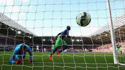 Papiss Cisse of Newcastle United scores the second, equalising goal in a 2-2 draw against Swansea City on Saturday at the Liberty Stadium in Swansea. Michael Steele / Getty Images