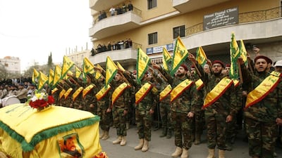 Hizbollah fighters are seen attending the funeral of a comrade who died in combat in Syria on March 18, 2017. Mahmoud Zayyat / AFP