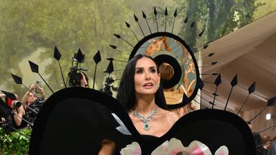 Demi Moore wears Harris Reed. AFP