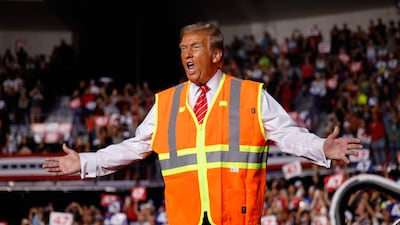 Republican presidential nominee, former President Donald Trump greets supporters during a campaign event at the Resch Center on October 30 in Green Bay, Wisconsin. Getty Images via AFP