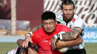 UAE and China in action during the Dialog Asia Rugby Sevens Series at Rugby Park in Dubai Sports City.