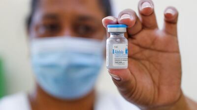 A nurse holds up a vial of Cuba's Abdala vaccine in Havana. Cuba is likely to seek export contracts for its vaccines. EPA-EFE