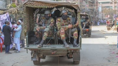 Bangladeshi troops patrol the Kanchpure area of Narayanganj during the landmark election. EPA