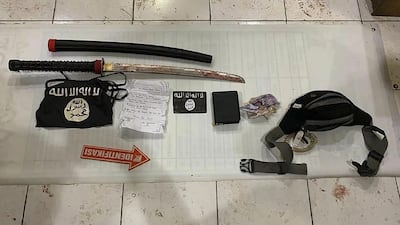 Belongings of one of the attackers who killed an Indonesian policeman and critically injured another. AFP