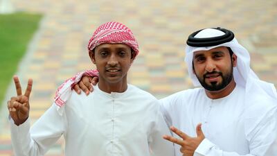 Abdul Hakim's strong relationship with his employer, Marzouq Al Hajerii, right, was a huge help during his battle with mouth cancer. Chris Whiteoak / The National