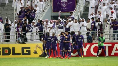Al Ain players celebrate Omar Abdulrahman’s opening goal. Karim Jaafar / AFP