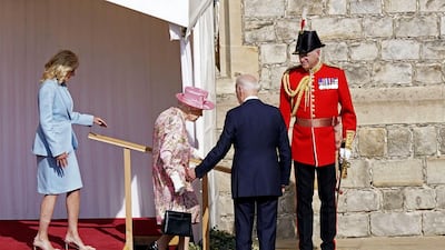 US President Joe Biden gestures to Britain's Queen Elizabeth II during a visit to Windsor Castle with First Lady Jill Biden. AP
