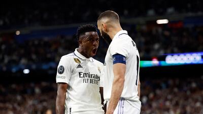 Real Madrid's Karim Benzema celebrates scoring their first goal with Vinicius Junior. Reuters