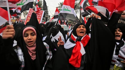 Women shout slogans as supporters of Moqtada Al Sadr gather in the capital Baghdad. AFP