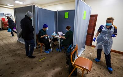 Yusuf Ismail, 78, speaks to medical staff before receiving an injection of the AstraZeneca Covid-19 vaccination as Bradford Central Mosque is opened as a community COVID-19 vaccination centre. Picture date: Thursday February 18, 2021. (Photo by Peter Byrne/PA Images via Getty Images)
