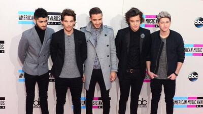 One Direction arrives for the 2013 American Music Awards at the Nokia Theatre. Frederic J. Brown / AFP Photo