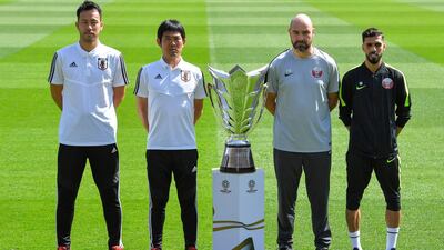 (L-R) Maya Yoshida of Japan and Japan Head coach Hajime Moriyasu and Qatar head coach Felix Sanchez Bas and Hasan Al Haydos of Qatar pose for photographs with Asian Cup trophy at Zayed Sports City Stadium in Abu Dhabi, United Arab Emirates. Getty Images