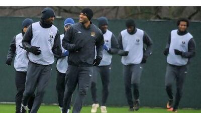 Patrick Vieira, left, and Joleon Lescott training at Manchester City's Carrington complex. Andrew Yates / AFP