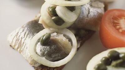 Smørrebrød, an open sandwich made with dark rye bread. Getty Images