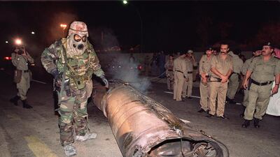 File photo of a US soldier, right, and Saudi police officers examine the wreck of a missile, believed to be a Soviet-made Scud, which landed in downtown Riyadh in January 1991 when Iraq launched a missile attack on the Saudi capital.