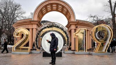 A man uses his smartphone outside the entrance to Kropotkinskaya metro station in Moscow, Russia. AFP