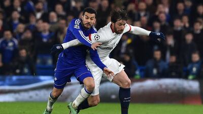 Paris Saint-Germain defender Maxwell, right, battles with Chelsea midfielder Pedro. Ben Stansall / AFP