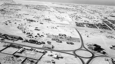 A roundabout in Deira with asphalt exits leading to sand roads not yet hardened, taken in the mid to late 1960s. Also shown is the new Deira Cinema under construction. Photo: Showpiece City: How Architecture Made Dubai, Stanford University Press; John R. Harris Library