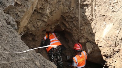 Rescuers work near the tunnel of Nepal's Trishuli 3A Hydropower Project. Reuters