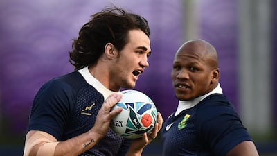 TOPSHOT - South Africa's lock Franco Mostert (L) and South Africa's hooker Bongi Mbonambi take part in a training session at Fuchu Asahi Football Park in Tokyo on October 23, 2019, ahead of their Japan 2019 Rugby World Cup semi-final against Wales. / AFP / Anne-Christine POUJOULAT