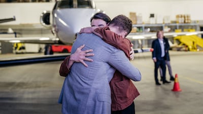 EU diplomat Johan Floderus is reunited with his family at Arlanda airport in Stockholm, Sweden, after being detained in Iran. AP