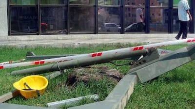 A bright yellow hard hat is among the remnants of the broken platform that killed two window cleaners. Delores Johnson / The National.