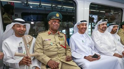 From left, Emirati paralympian Naseeb Sebait; Maj Gen Anas Al Matrooshi of Dubai Police; Hussain Lootah of Dubai Municipality; Khalifa bin Darray of Dubai Ambulance Service; and Obaid Al Shamsi, also of the municipality, opted for the Metro on Sunday. Victor Besa for The National