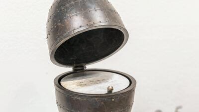 Larissa Sansour's Archeology in Absentia. The Palestinian artist's "bronze sculpture partly resembles a bomb and partly a Fabergé egg. It contains a metal disc inscribed with coordinates which refer to locations on the West Bank where the artist has buried porcelain as part of a performance. The piece may be considered a case of reverse archaeology, or a reversal of traditional museum logic, as the objects are placed in the ground today only in order to reemerge in a distant future as archaeological proof."