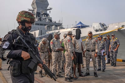 Mumbai Police takes charge of the accused Somali pirates brought by the Indian navy on its warship INS Kolkata at Naval Dockyard in Mumbai on Saturday. AP