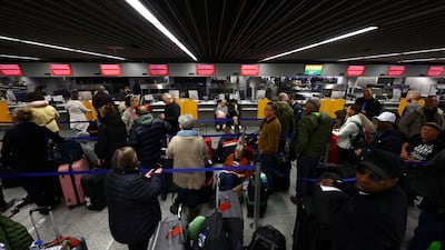 A queue of passengers at a Lufthansa check-in counter in Frankfurt. Reuters