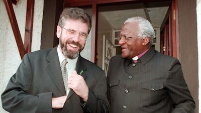 The former leader of Northern Ireland's Sinn Fein, Gerry Adams, meets Tutu in Belfast. PA