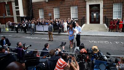 Britain's Prince William and his wife Catherine, Duchess of Cambridge appear with their baby boy, outside the Lindo Wing of St Mary's Hospital. REUTERS / Suzanne Plunkett