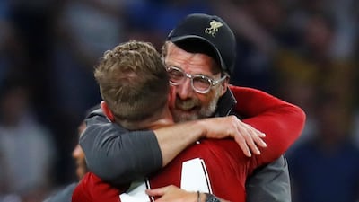 Klopp embraces his captain Jordan Henderson. Reuters