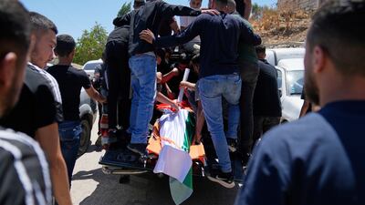 Three Palestinians were killed by Israeli troops during a settler attack in the West Bank. AP