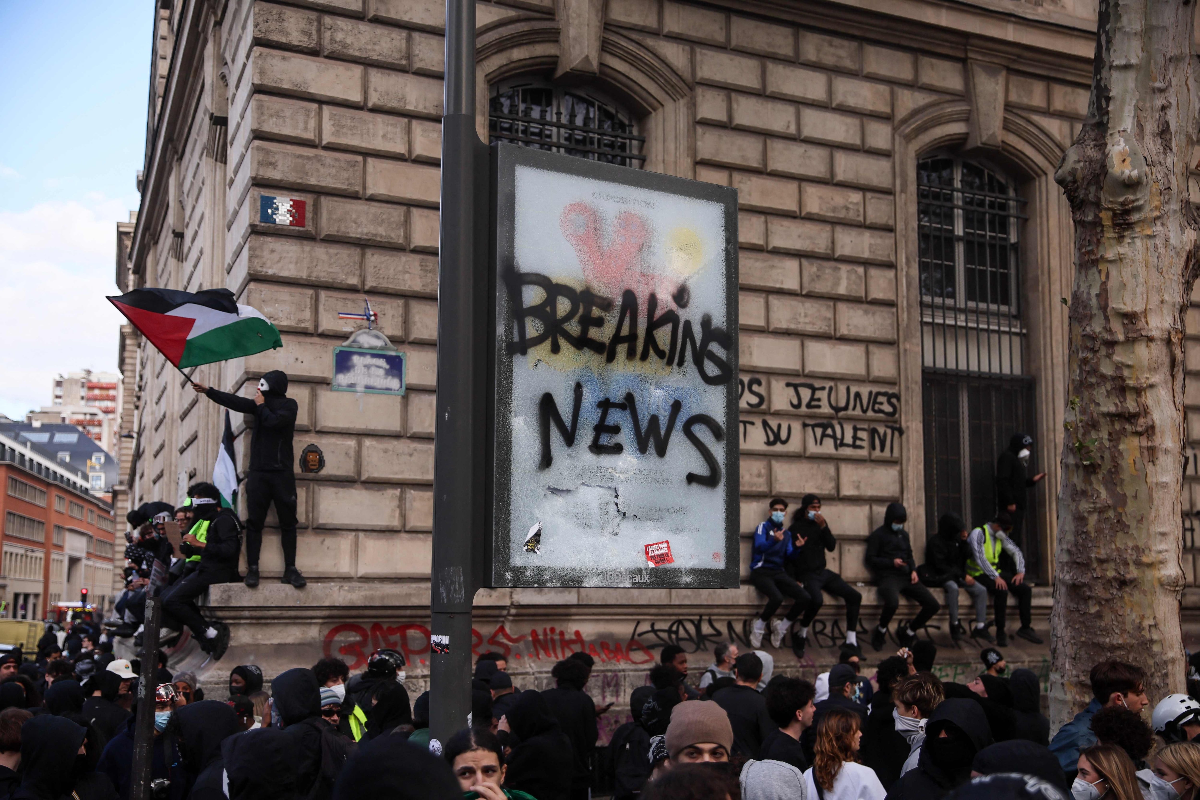 A protester waves a Palestinian flag, in Paris AFP