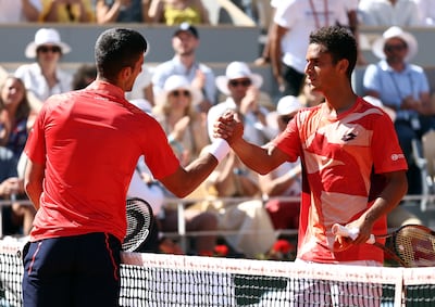 Novak Djokovic of Serbia shakes hands with Juan Pablo Varillas of Peru after winning their fourth-round match. EPA