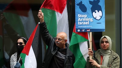 Pro-Palestinian protesters demonstrate against Barclays's purchase of Tesco Bank outside the Royal Courts of Justice in London. EPA