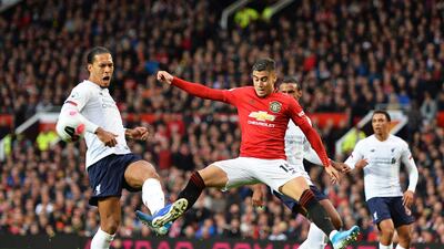 Liverpool's Virgil van Dijk in action against Manchester United's Andreas Pereira. EPA